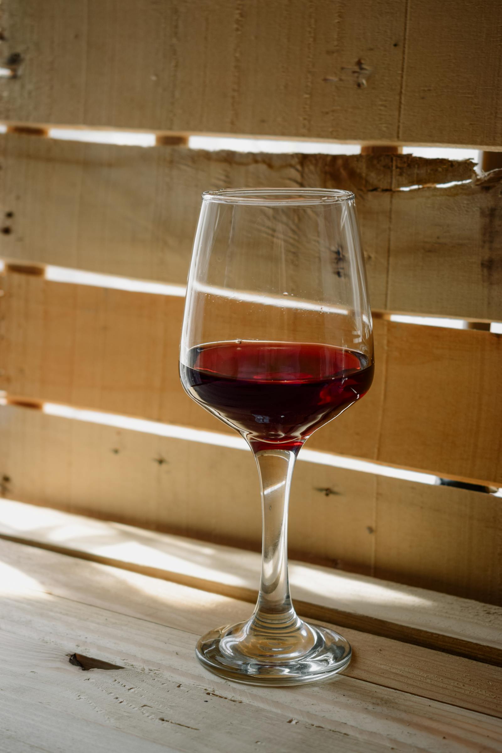 vancroft Franc 2022 — a glass of bright ruby Cabernet Franc in afternoon sun.